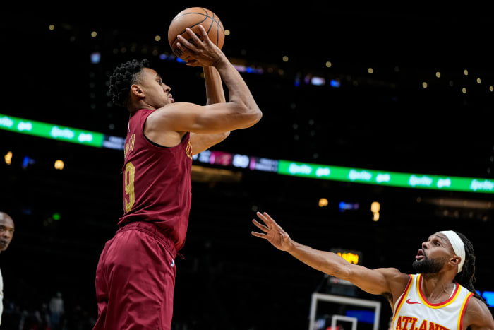 Oct 10, 2023; Atlanta, Georgia, USA; Cleveland Cavaliers guard Zhaire Smith (19) shoots over Atlanta Hawks guard Patty Mills (8) during the second half at State Farm Arena. Mandatory Credit: Dale Zanine-USA TODAY Sports